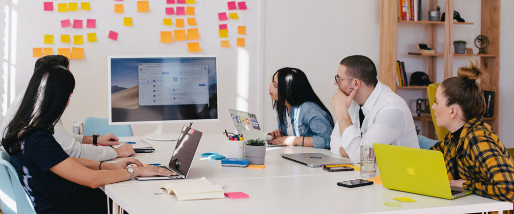 a team works together at a computer