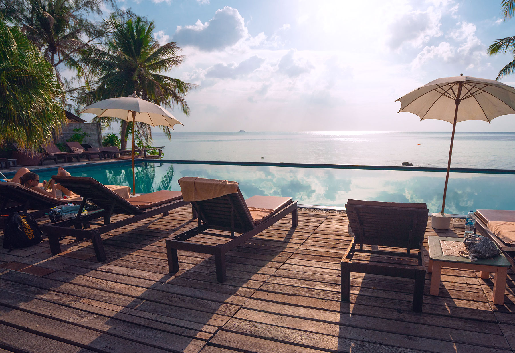 hospitality-vacation-pool-side hospitality customer journey success client story, hotel pool and view of the ocean