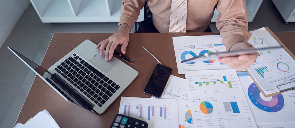 Photo illustrating data analysis and person trying to choose the right tools for AI insights