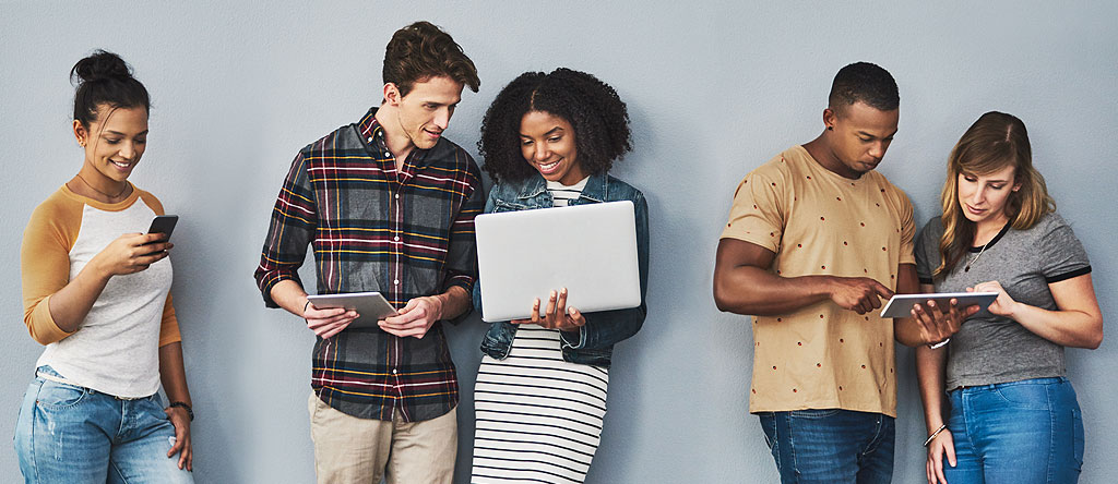 People using computer and other devices that represent customer journey map patterns