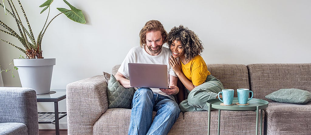 Two people excitedly their content experience online