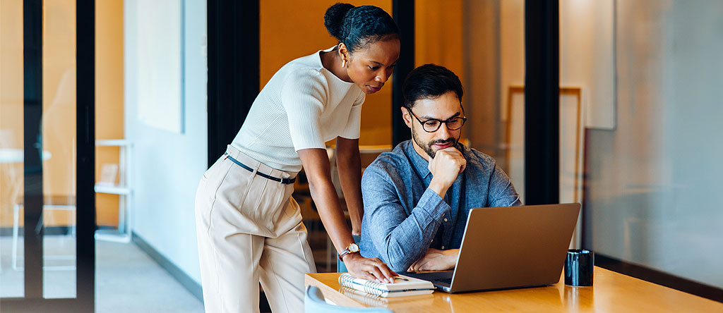 Cross-functional team reviewing AI-driven analytics insights together to drive faster decision-making
