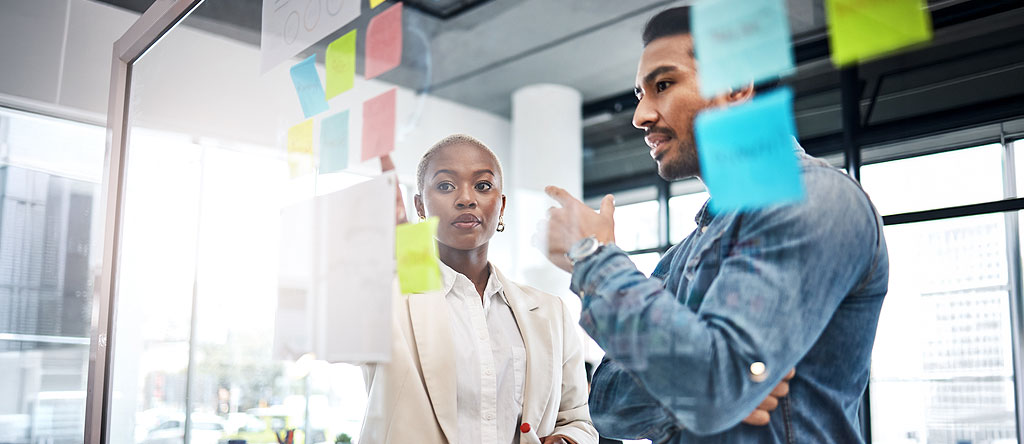 Team reviewing analytics alerts and prioritizing coordinated action in response to emerging issues