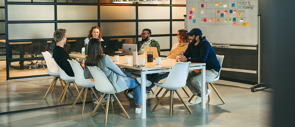 cross functional customer experience team discussing CX trends