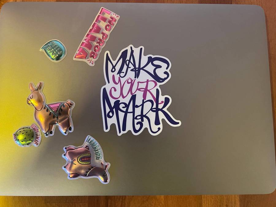 MYM sticker on laptop