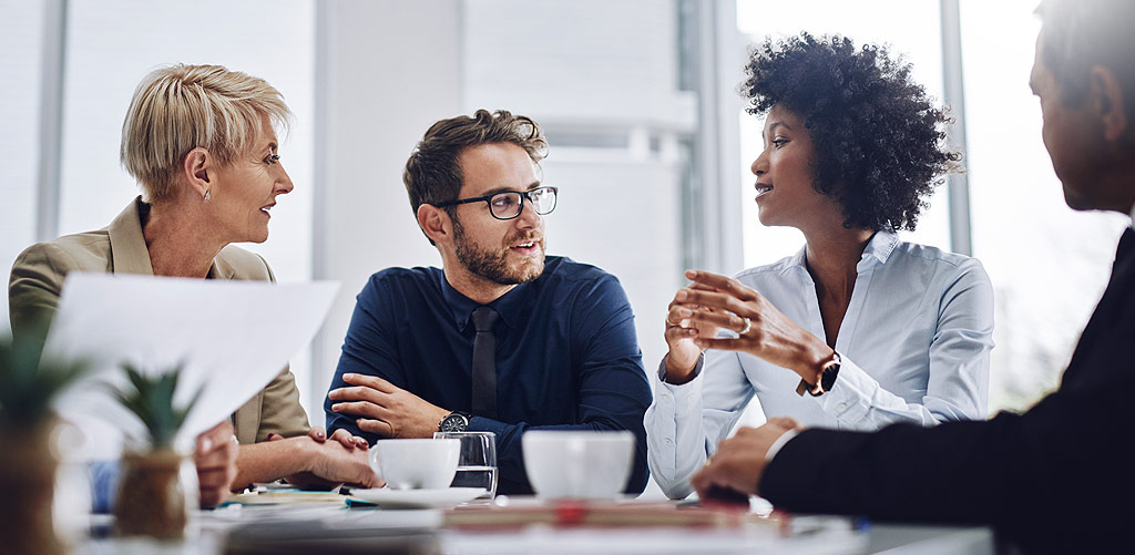 Analysts and team making a business decision in a meeting