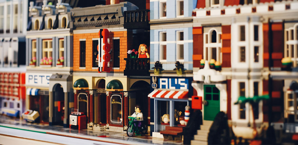 Completed toy brick city set to represent a fixed broken customer experience