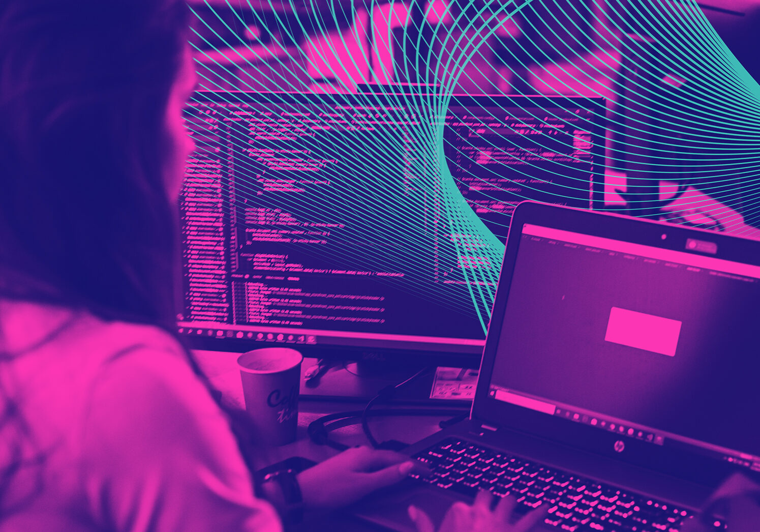 a woman uses a computer at her desk